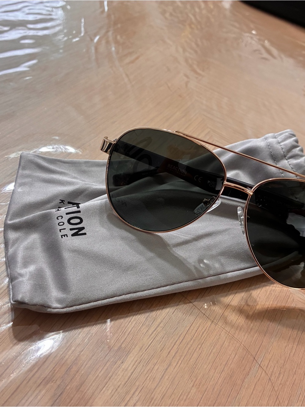 Kenneth Cole Gold Frame Aviator Sunglasses with Black Lenses